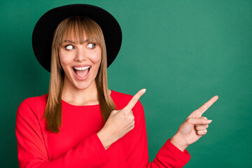 Canvas Print - Portrait of young attractive pretty excited crazy happy girl pointing fingers copyspace isolated on green color background