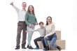 © ASDF - in full growth. happy family with cardboard boxes.