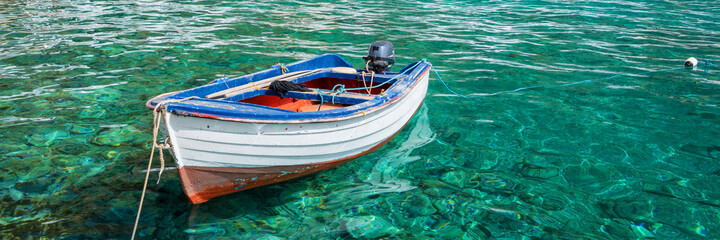 Wall Mural - ffishing boat on panoramic clear pristine water in crete, greece