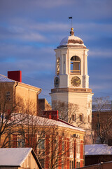 clock tower in the ancient city of Vyborg, Russia, in winter .colorful sunset