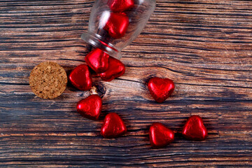 Sticker - Top view of candy hearts pouring out of a jar