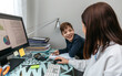 © David Pereiras - Woman teleworking at home talking with her son