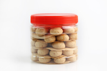 Chinese New Year traditional butter cookies in plastic containers isolated on white background.