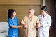 © Thirawatana - Doctors and physical therapists are caring for elderly sick people.