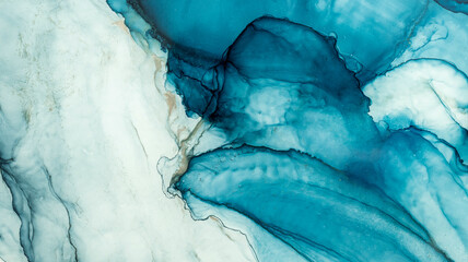  Tidewater alcohol stains of paint with the addition of gold powder. Subtle waves of paint, abstract blue waves of the ocean, lines of marble. Liquid paints, gradient stains, painting. Tinting Tidewate