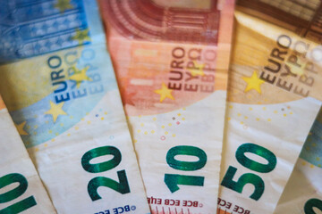 Euro banknotes. table covered with banknotes. Close up.