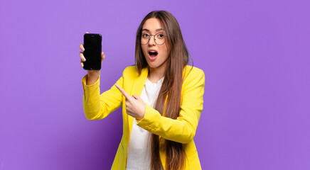 Wall Mural - tty woman showing her cell screen.