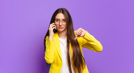 Wall Mural - tty woman showing her cell screen.