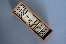 Box With Retro Dominoes On Table