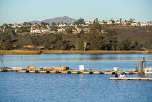 Wood Pier With Pedal Boat And Small Boat. Miramare Lake, San Diego, California, USA. 