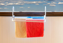 Three Colored Towels On The Dryer Close-up