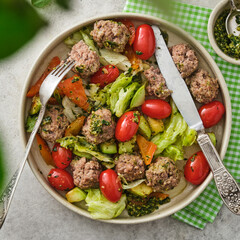 Wall Mural - Meatballs with cherry tomatoes and salad.