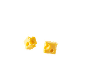 Two pieces of appetizing cheese in the shape of cubes on a white background. Cheese advertising