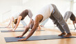 © JackF - Portrait of focused man making yoga exercises with friends at fitness center