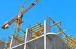 © Unkas Photo - Crane and highrise construction site