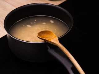 pot with food and wooden spoon