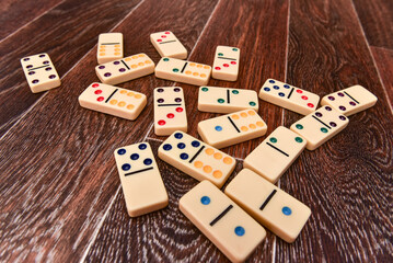 domino blocks lying on an old wooden surface. flat lay. top view