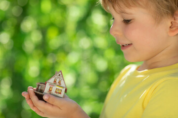 Canvas Print - Eco house in children`s hands