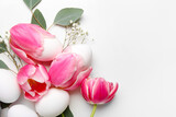 Fototapeta Tulipany - Beautiful Easter composition with eggs and spring flowers on white background