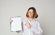 © SHOTPRIME STUDIO - Beautiful Business woman with documents in a folder gestures with her hands Copy Space