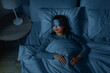 © Syda Productions - people, relax and comfort concept - young asian woman in eye mask sleeping in bed at home at night