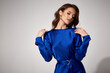 © indiraswork - Beautiful woman fashion model makeup brunette hair perfect body shape tanned skin wear clothes summer collection organic mini blue silk dress stylish sandals shoes, accessory romantic date walk.