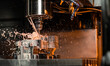 © Daniel - CNC machining centre drilling steel and using metal working fluid as coolant