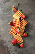Waffles with juicy strawberries.
