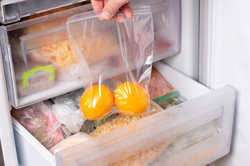 Wall Mural - Frozen lemon in a bag in the freezer