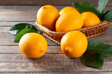 Wall Mural - Fresh lemons on wooden table