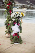Wedding decoration at a pier by the beach with flowers