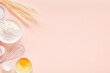 © tbralnina - Ingredients for baking on light pink background.