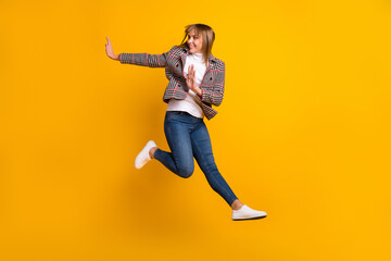 Canvas Print - Full body photo of carefree lady hands palms look empty space have fun isolated on yellow color background