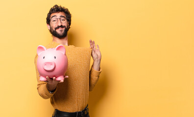 Sticker - young crazy bearded man with a piggy bank