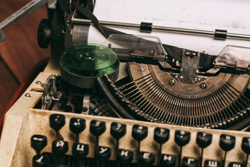 Fototapete - typewriter with keys letters paper wood background texture