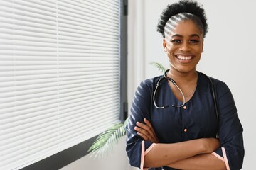 Portrait Of Smiling Female Doctor Wearing White Coat With Stethoscope In Hospital Office