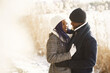 © prostooleh - People walks outside. Winter day. African couple