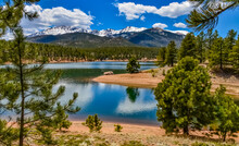 Panorama Snow-capped And Forested Mountains Near A Mountain Lake, Pikes Peak Mountains In Colorado Spring, Colorado, US