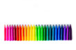 Felt-tip pens on a white background. Multi-colored markers are beautifully folded by the color of the rainbow. Creativity and design concept.