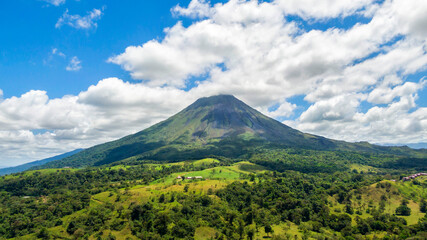 Amazing view of beautiful nature of Costa Rica with smoking volcano Arenal background. Panorama of volcano Arenal, La Fortuna, Costa Rica. Central America.