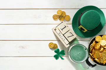 st. patricks day concept - green beer and symbols, rustic background. part invitation.