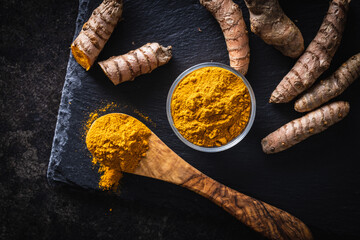 Poster - Indian turmeric powder and root. Turmeric spice. Ground turmeric.