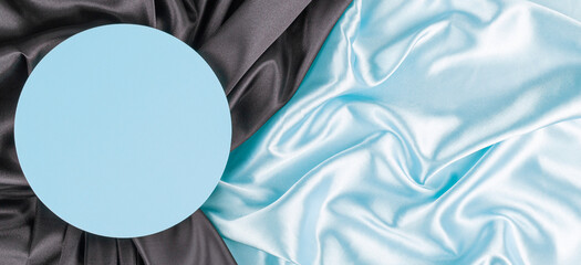 Wall Mural - Geometric platform podium on light blue silk satin background. Blank minimal cylinder form mock up background for cosmetic product presentation