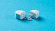 Large white pill broken into two halves on blue background