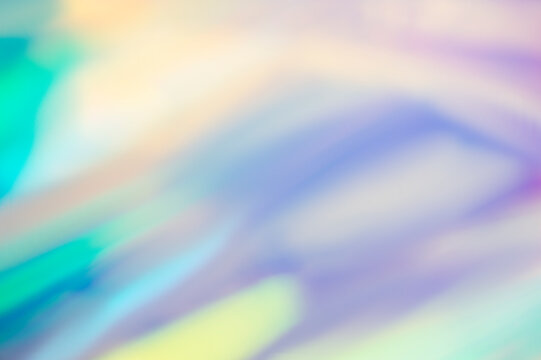 Holographic foil blurred abstract background for trendy design. Fantasy colorful card. Holographic sparkly cover with soft pastel colors