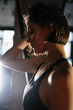 Portrait of Confident Brunette Woman Wearing Performance Wear in Gym