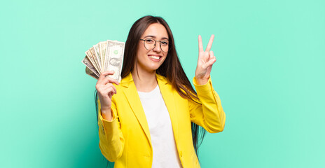 Poster - young pretty businesswoman with dollar banknotes