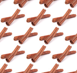 Wall Mural - Cinnamon sticks  isolated on white background . Seamless food pattern.