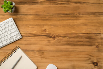 Overhead above close up flat lay view photo picture of computer keyboard mouse and plant isolated brown backdrop with copy space