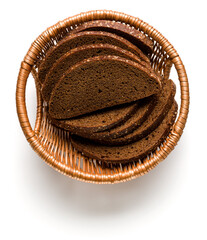 Wall Mural - Rye bread slices in wicker basket isolated over white background. Flat lay, top view.